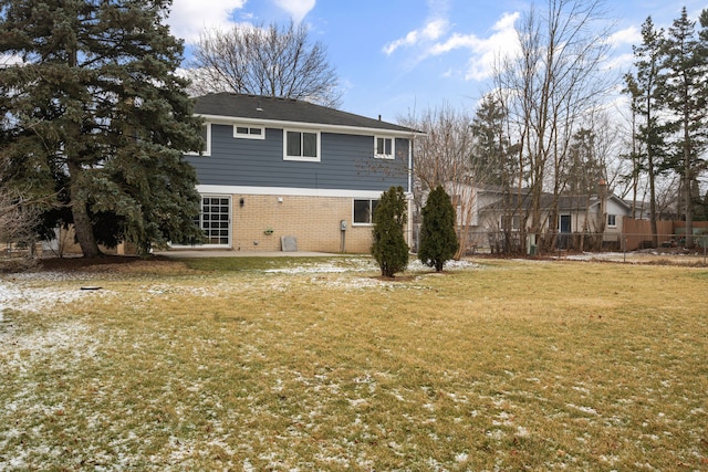 rear view of house with central AC, a yard, and a patio