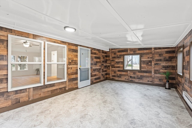 interior space featuring wooden walls and baseboard heating