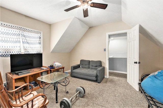 office area featuring ceiling fan, carpet, lofted ceiling, and a textured ceiling