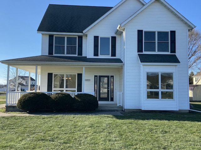 view of front of property with covered porch and a front yard