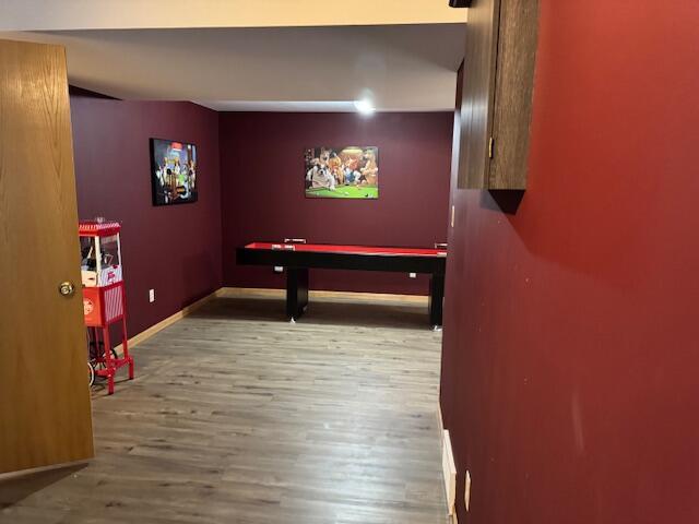 game room with hardwood / wood-style flooring