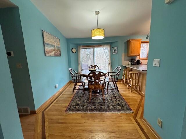 dining room with light hardwood / wood-style floors