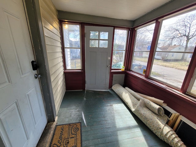 unfurnished sunroom featuring a healthy amount of sunlight