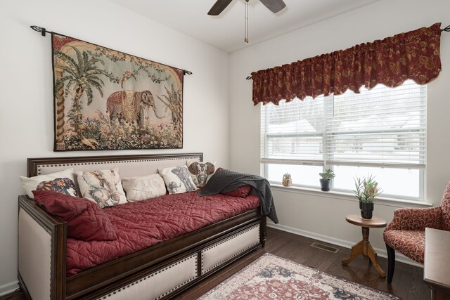 bedroom featuring dark hardwood / wood-style flooring and ceiling fan