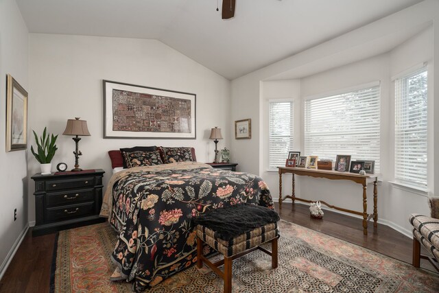 bedroom with vaulted ceiling, dark hardwood / wood-style floors, and ceiling fan