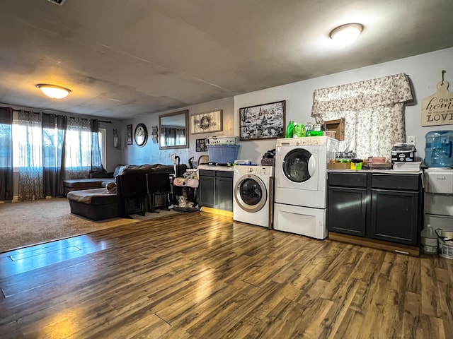 washroom featuring separate washer and dryer and dark wood-type flooring