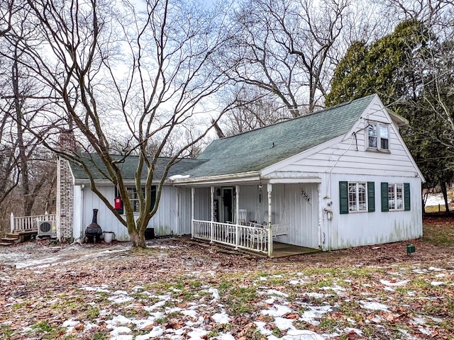 view of front facade with ac unit and a porch