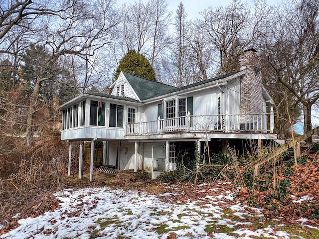 exterior space featuring a deck and a sunroom