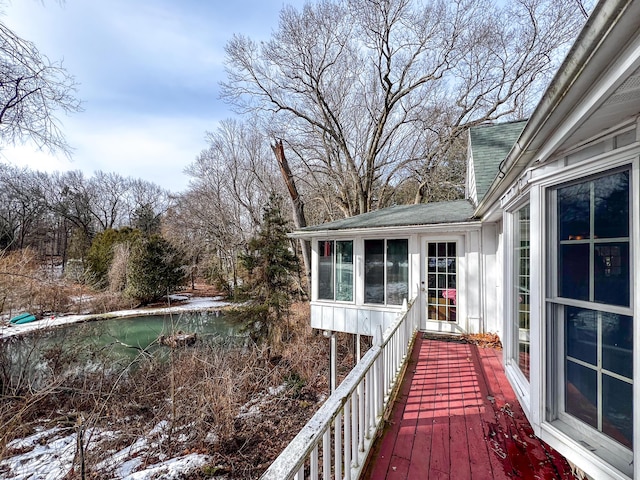 wooden deck featuring a sunroom