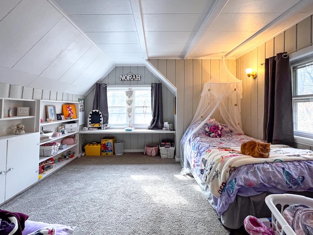 bedroom with carpet floors, wood walls, and lofted ceiling with beams