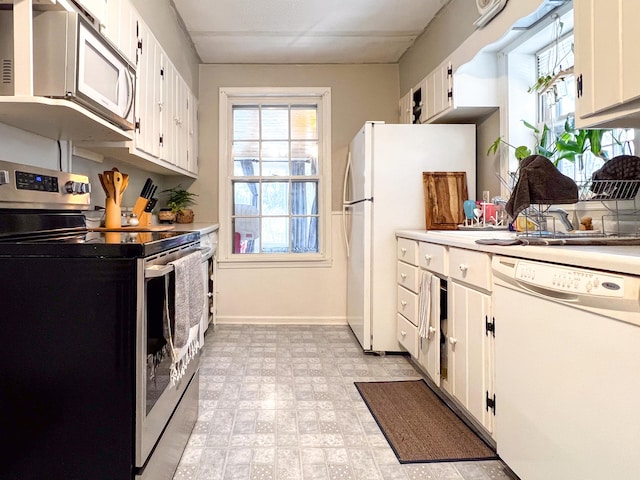 kitchen with stainless steel appliances and white cabinets