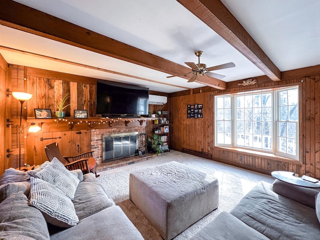 carpeted living room featuring beam ceiling, a wall unit AC, wood walls, and a brick fireplace