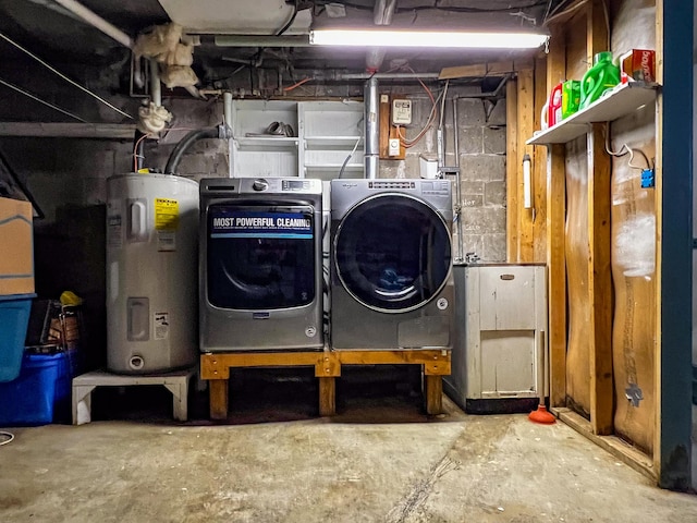 laundry area with water heater and separate washer and dryer