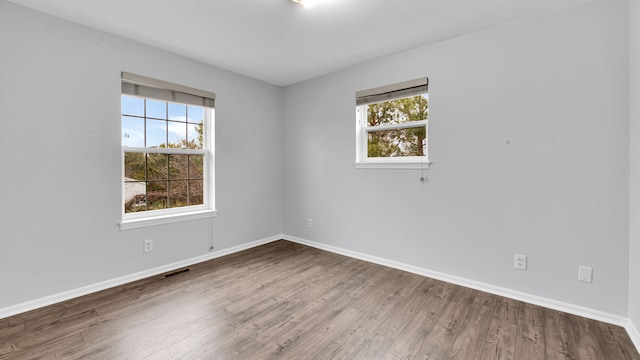 empty room featuring hardwood / wood-style flooring