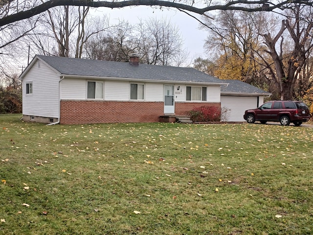 ranch-style house featuring a garage and a front yard