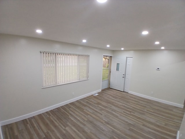 unfurnished room featuring hardwood / wood-style flooring