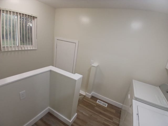 laundry area featuring dark hardwood / wood-style flooring and separate washer and dryer