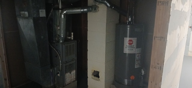 utilities featuring water heater and heating unit