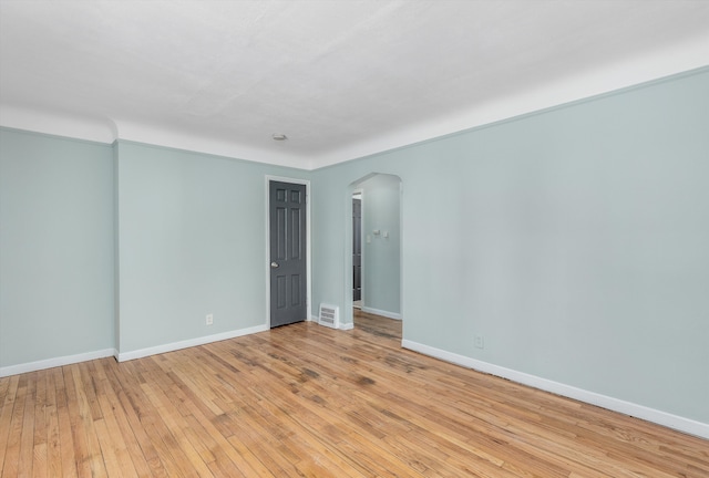 unfurnished room with light hardwood / wood-style floors