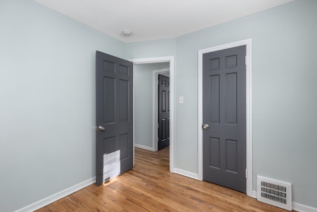 unfurnished bedroom featuring light hardwood / wood-style floors