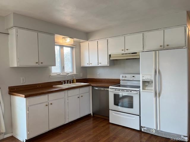 392 Hillcrest Dr, Saline, MI 48176 - kitchen featuring white appliances, under cabinet range hood, dark countertops, and white cabinets