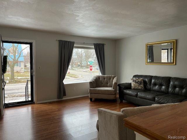 392 Hillcrest Dr, Saline, MI 48176 - living room featuring wood finished floors and baseboards