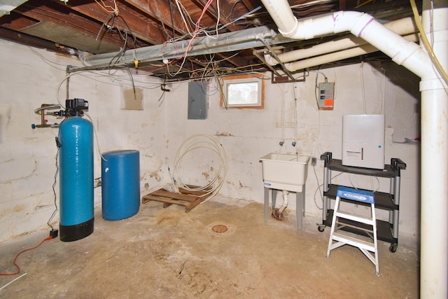 basement featuring sink and electric panel