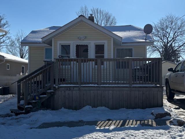 view of front of home featuring a porch and central AC unit