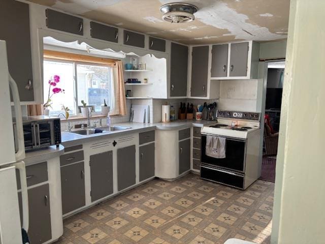 kitchen featuring tasteful backsplash, sink, and white appliances