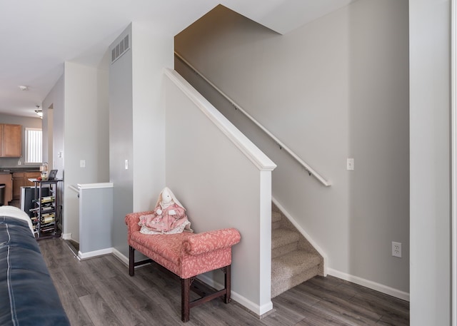 stairway with hardwood / wood-style flooring