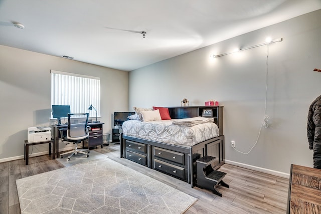 bedroom featuring hardwood / wood-style flooring