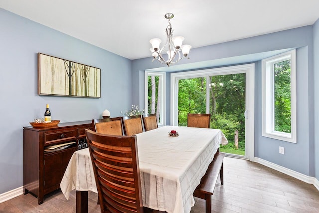 dining room featuring an inviting chandelier and hardwood / wood-style floors