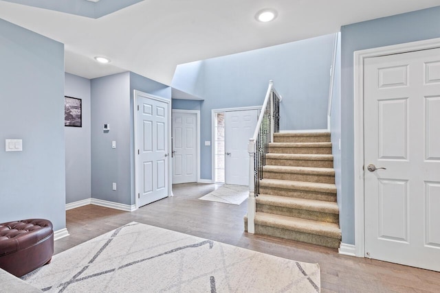 foyer entrance with light hardwood / wood-style floors