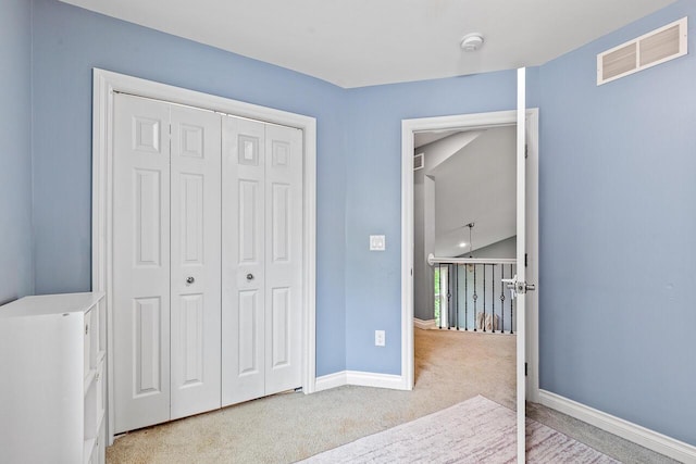 carpeted bedroom with a closet