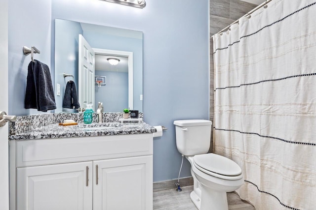 bathroom with vanity, a shower with curtain, wood-type flooring, and toilet