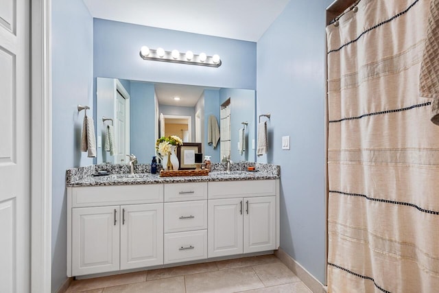 bathroom with vanity and tile patterned flooring