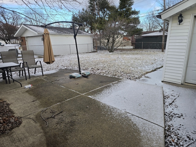 view of yard featuring a garage and a patio area