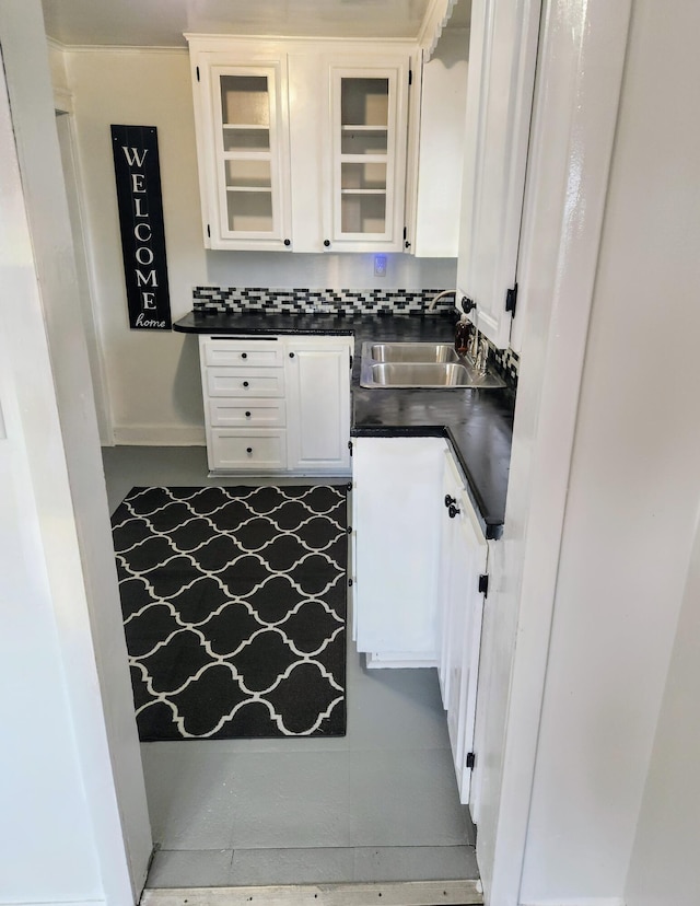 kitchen with white cabinetry and sink