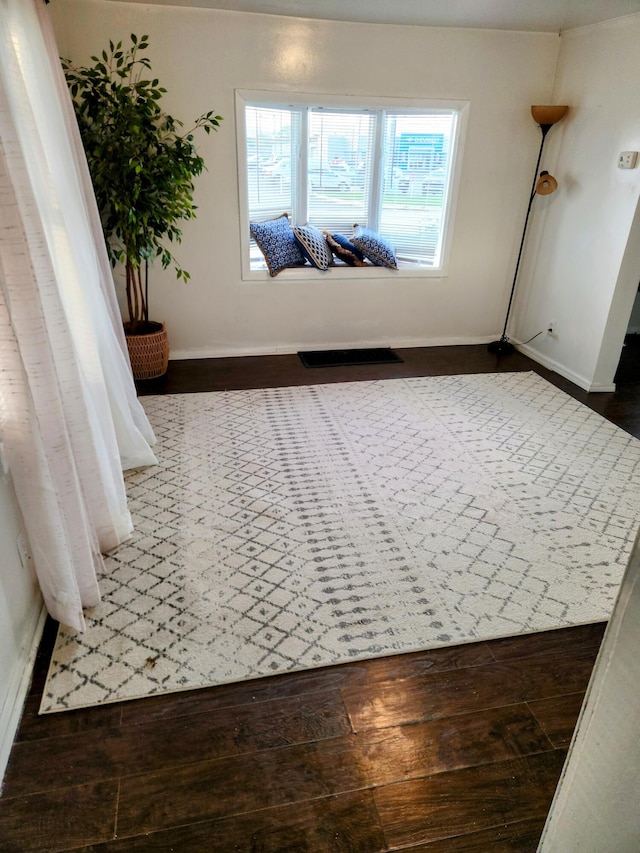 hallway with dark wood-type flooring