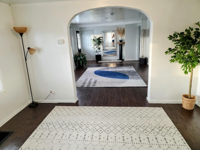 corridor with dark hardwood / wood-style flooring