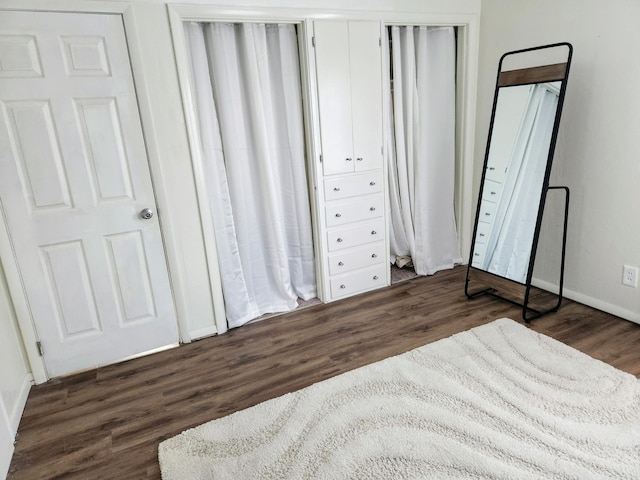 unfurnished bedroom featuring dark hardwood / wood-style floors