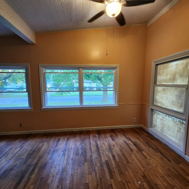 unfurnished room featuring dark hardwood / wood-style floors and ceiling fan