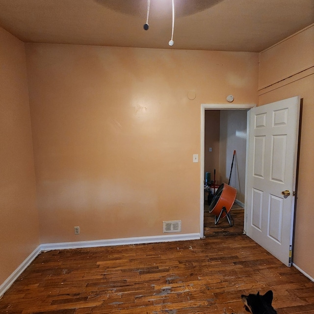 empty room featuring dark wood-type flooring