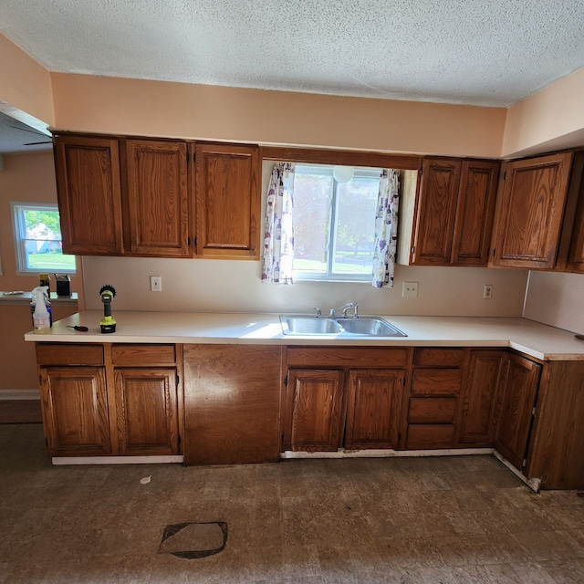 kitchen featuring sink and a textured ceiling