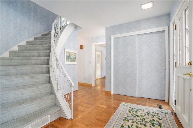 foyer with parquet flooring