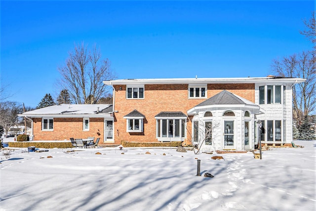 view of snow covered house