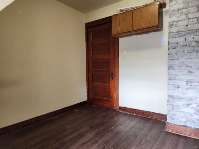 empty room with dark hardwood / wood-style floors