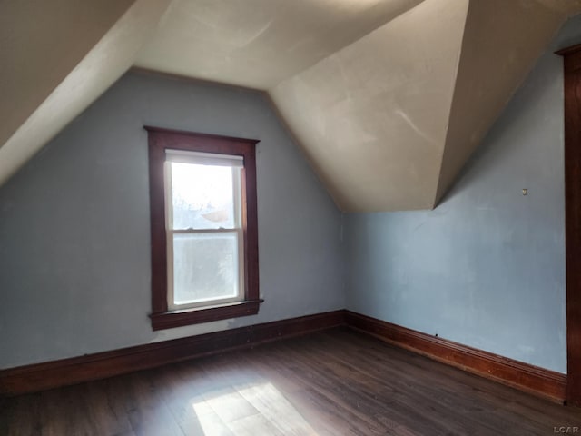 bonus room featuring hardwood / wood-style flooring and vaulted ceiling