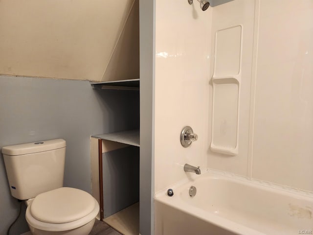 bathroom with toilet and tub / shower combination