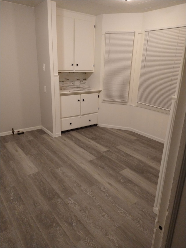 unfurnished bedroom with dark hardwood / wood-style floors